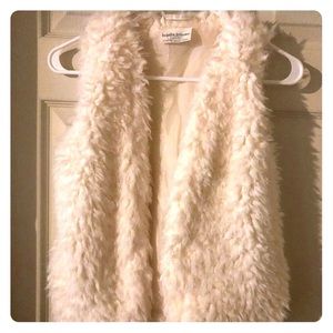 White fur vest